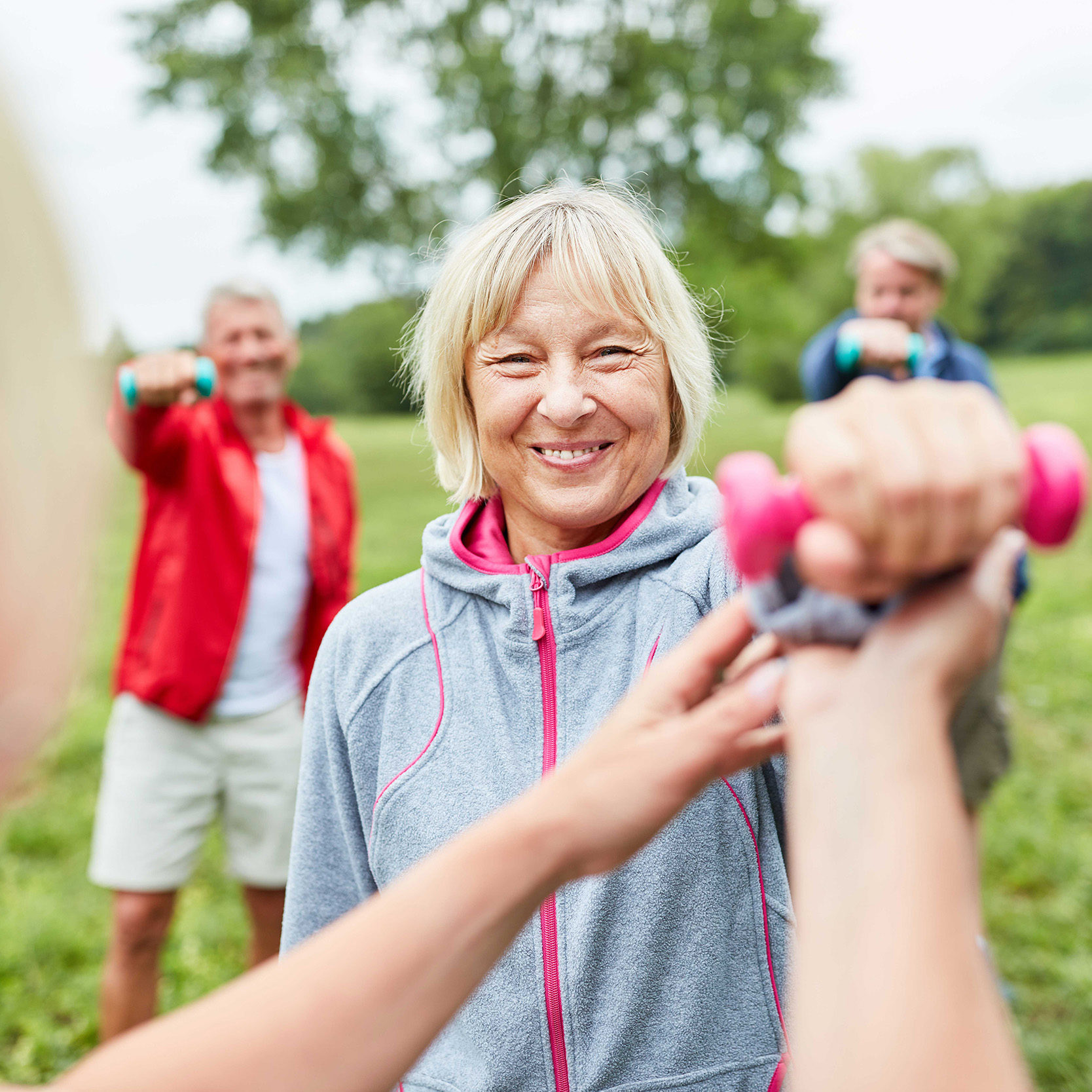 group of people in an outdoor fitness class