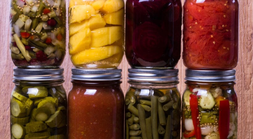 several foods packaged in Mason jars