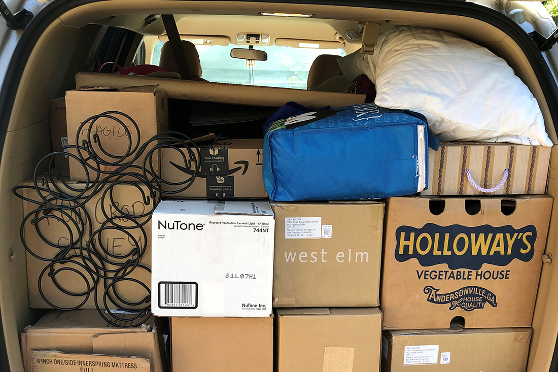 Picture of moving boxes in the back of a minivan
