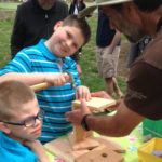 Picture of two young boys making a birdhouse