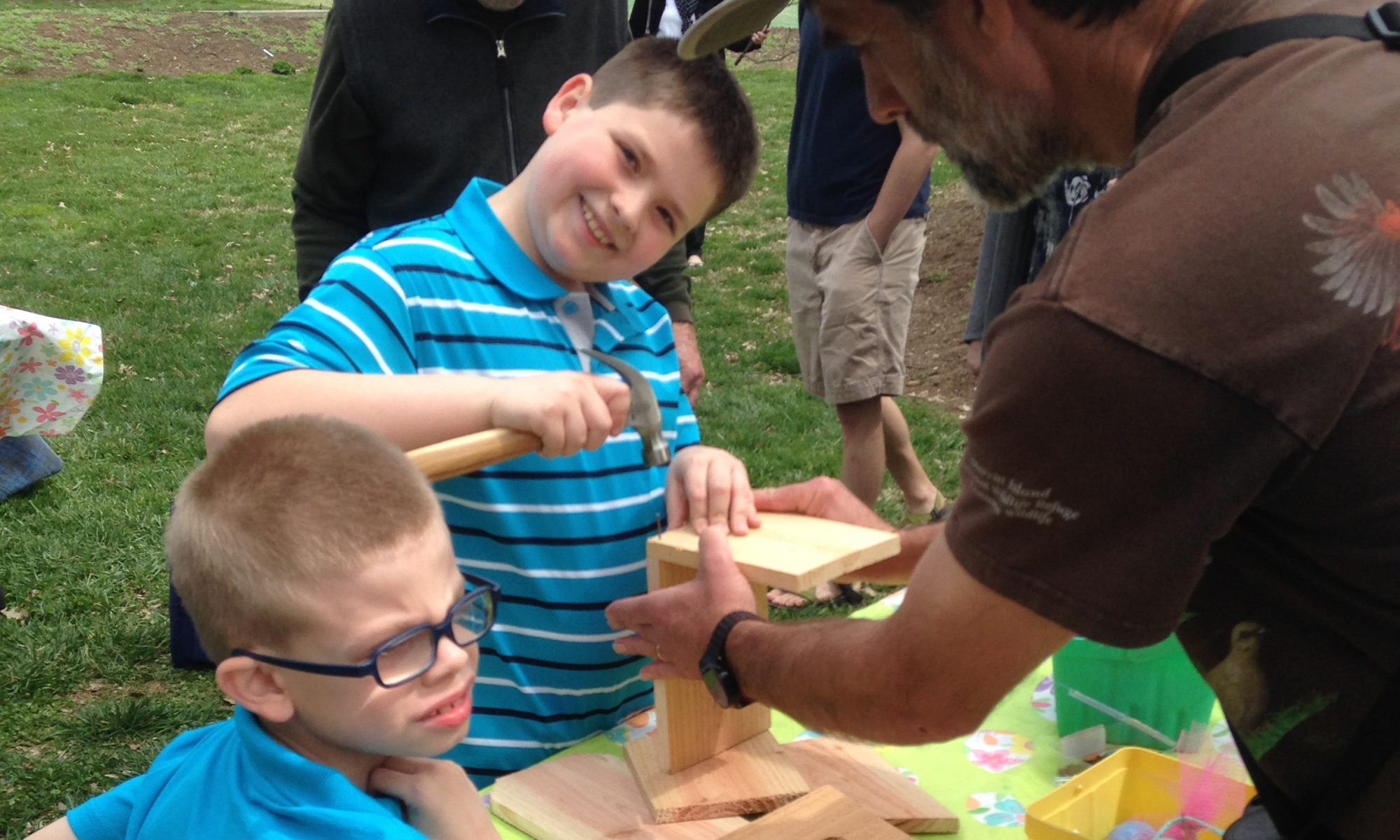 Picture of two young boys making a birdhouse