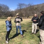 Picture of farmers talking in a circle