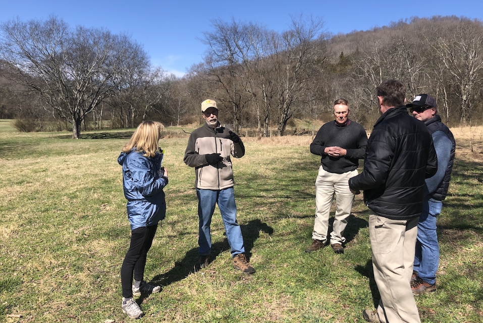 Picture of farmers talking in a circle