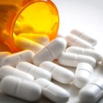 Picture of pills spilling out of a bottle