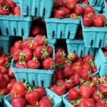 Picture of strawberries in pint containers to sell.