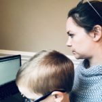 Picture of woman and child sitting at a laptop together