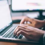 Picture of person typing on a laptop