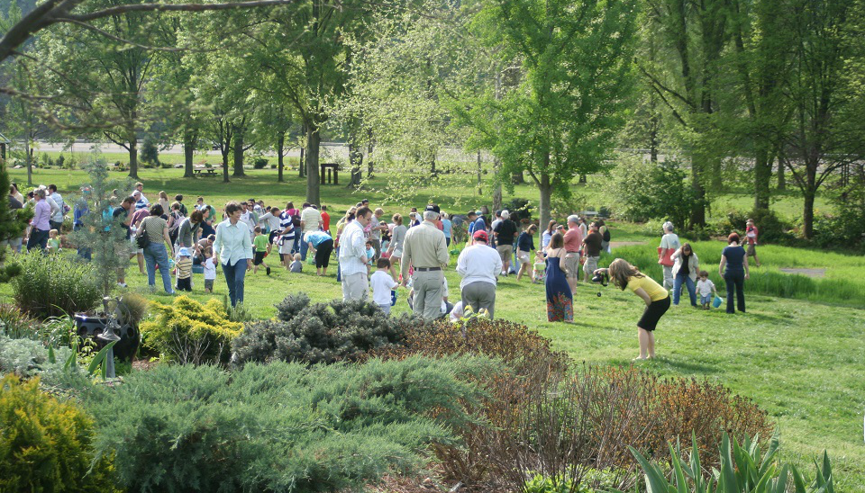 A large group of people gather for the Eggstravaganza, an Easter egg hunt event at UT Gardens