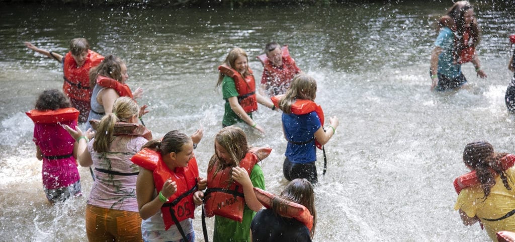 Children splashing in a creek